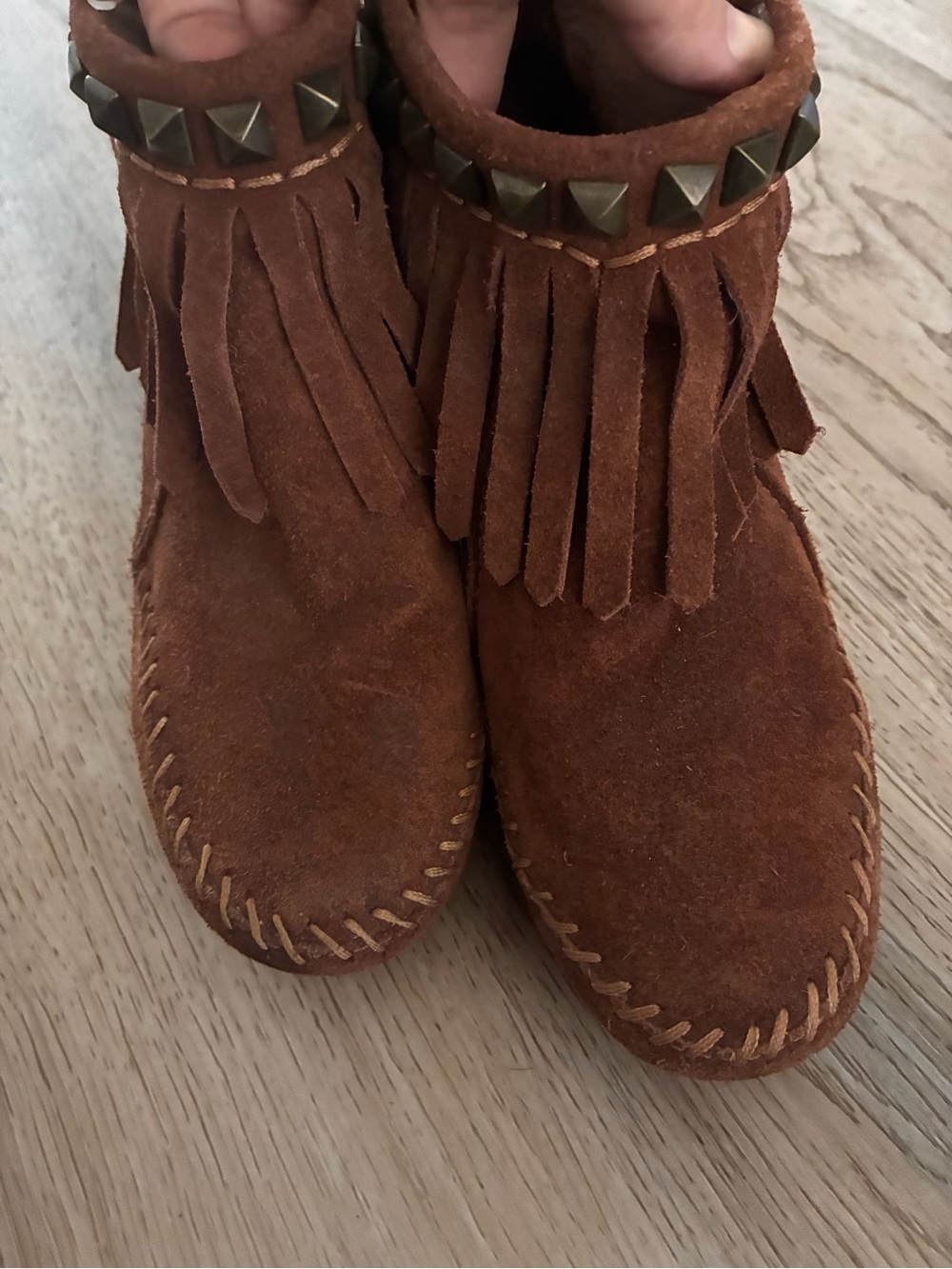 ASH womenโs Brown Fringe Moccasin Boots with Stud Trim